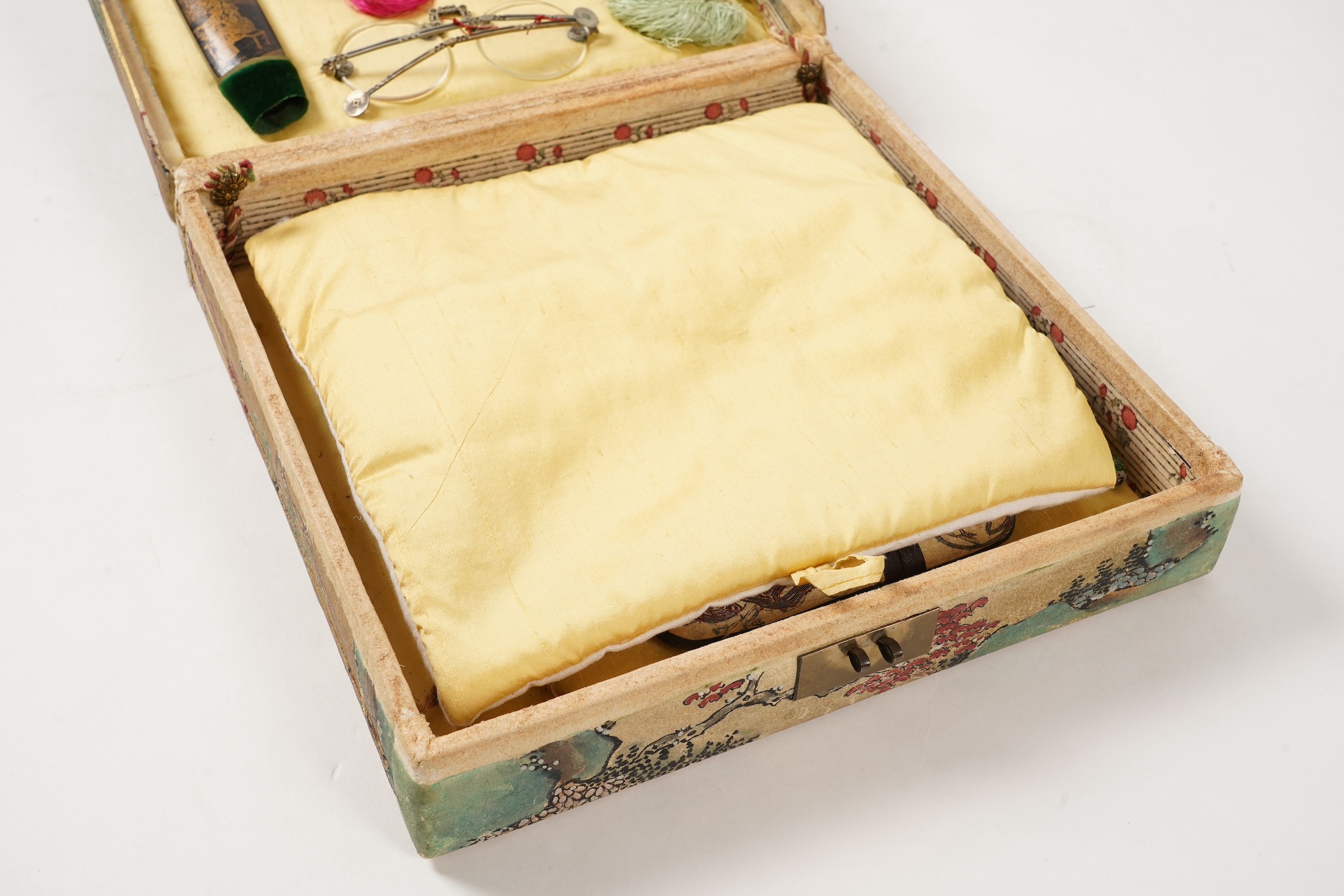 A collection of 19th/20th century Chinese embroidered silk spectacle cases and various spectacles, Box 33cm square